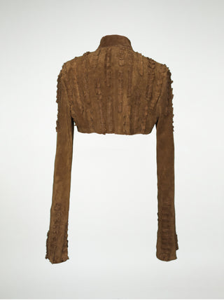 A back view of a brown suede over-bust shrug jacket with long sleeves and strips of pleated leather stitched onto the shoulders and sleeves.