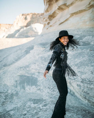 Judith Glory Hill wearing a call and response jacket