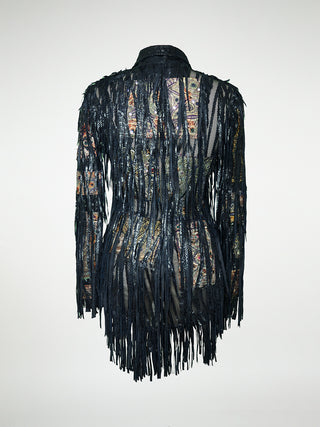 A back view of a black leather jacket with fringes and embellished with antique tapestry and Swarovski crystal rivets.