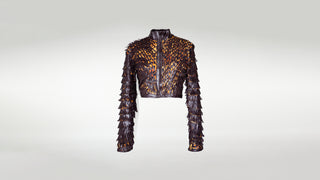 A stretch leather jacket with a leopard print base appliquéd with brown leather and eyelash fringes.