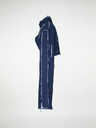 The side of a women's blue denim over-bust shrug with long sleeves and raw edge patchwork.