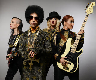 Prince and 3rd Eye Girl, all wearing Call and Response jackets, pants, and jumpsuits