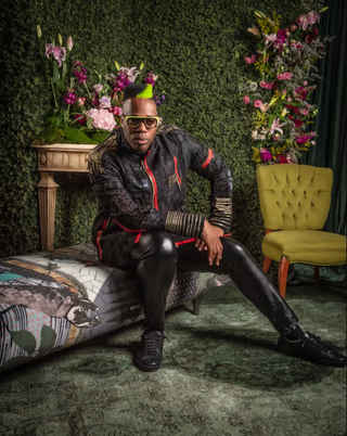 Kardinal Offishall wearing a call and response jacket at the CAFT Awards.