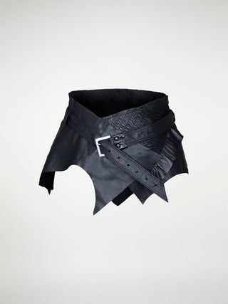 A black asymmetrical waist belt with raw leather edges and a silver buckle
