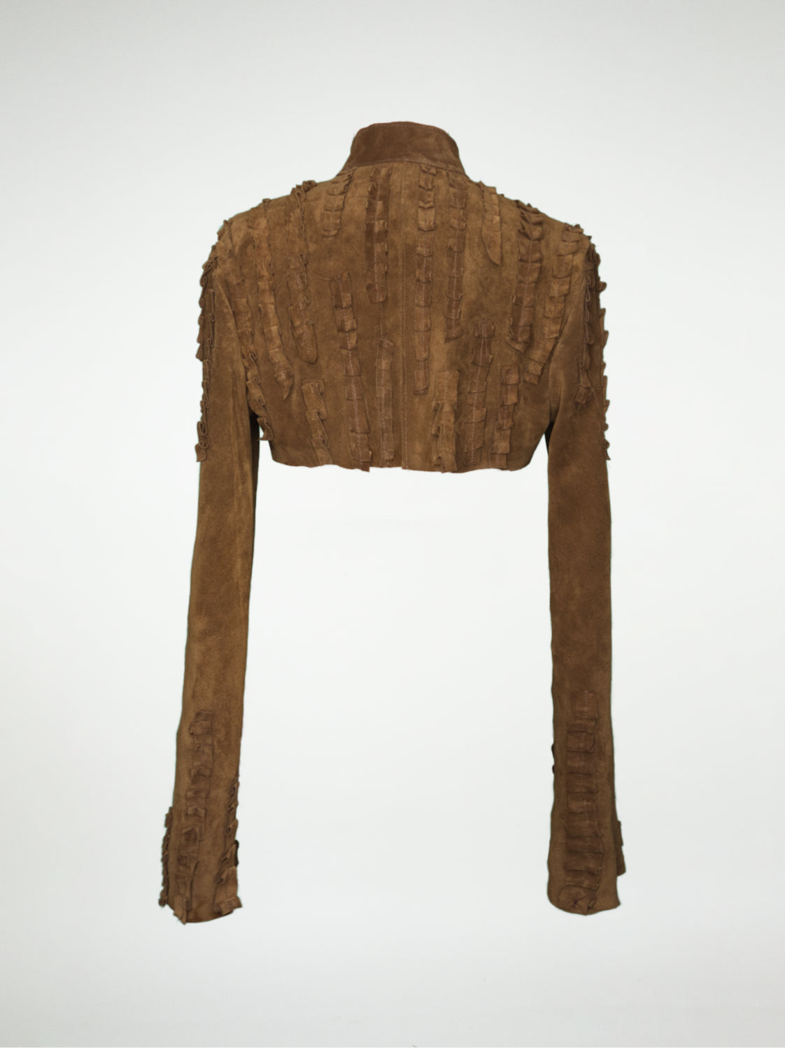 A back view of a brown suede over-bust shrug jacket with long sleeves and strips of pleated leather stitched onto the shoulders and sleeves.