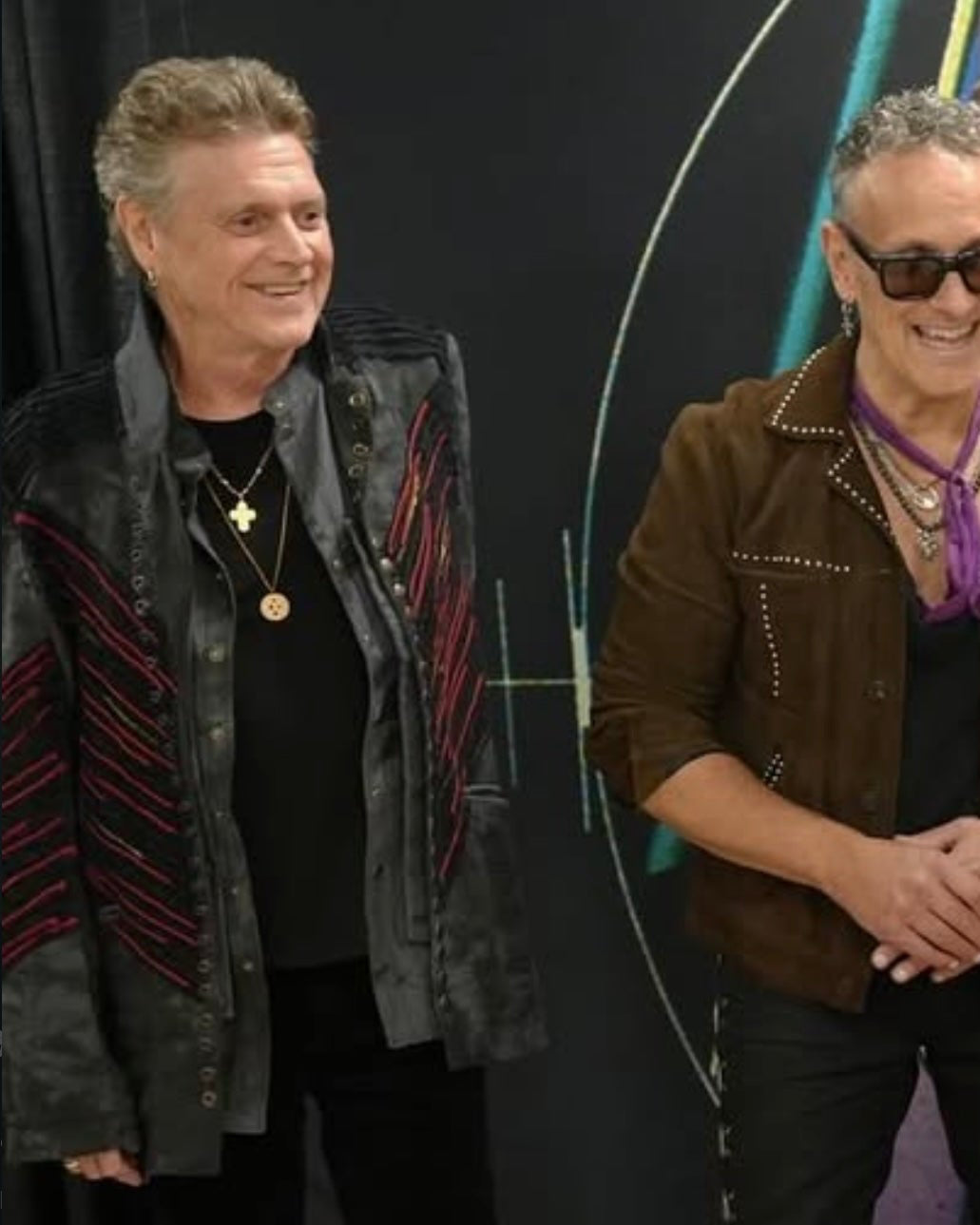 Rick Allen at a meet and greet wearing a Call and Response jacket.
