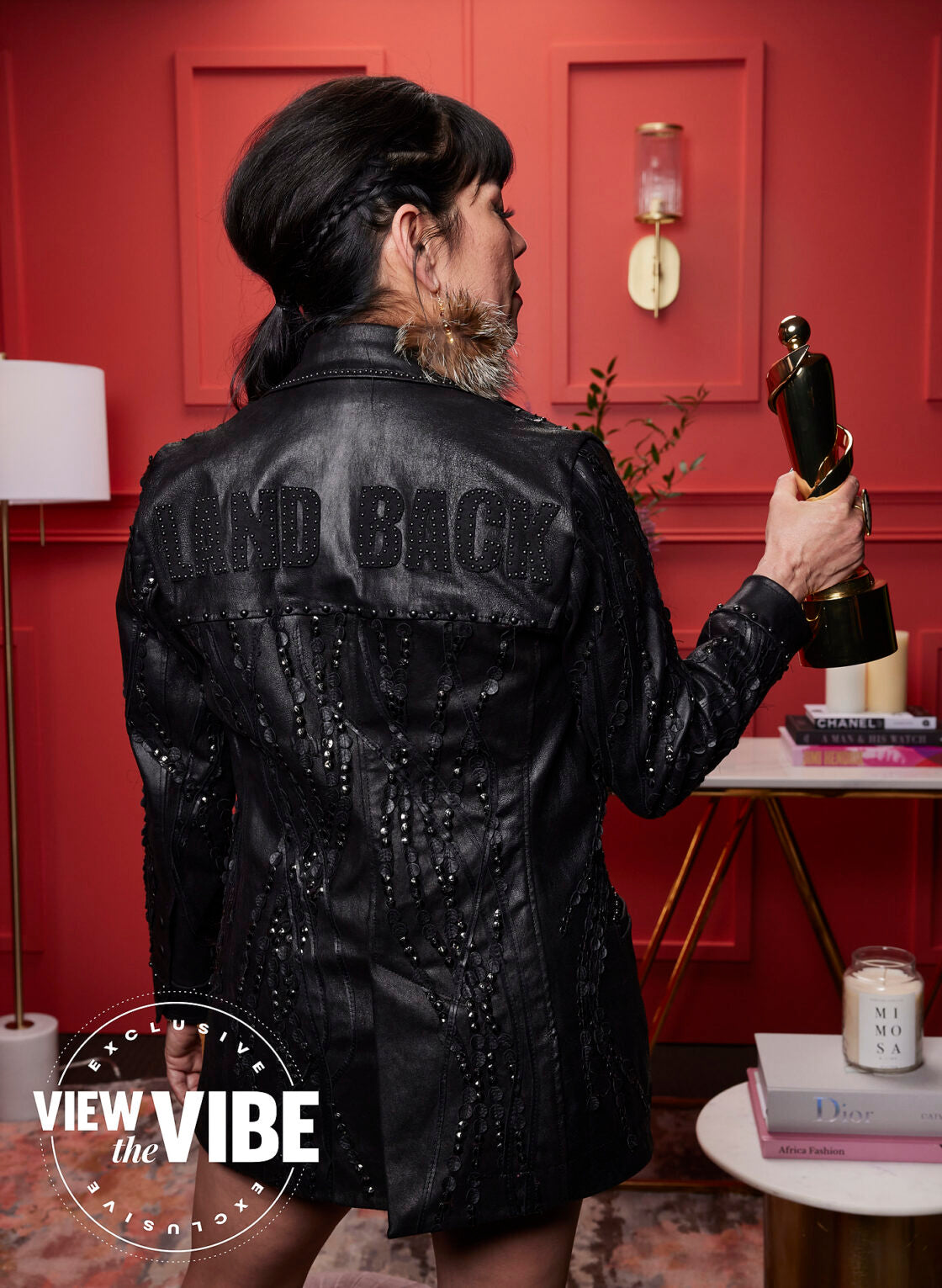 The members of the band Digging Roots wearing call and response jackets, pants, and shorts at the Juno Awards.