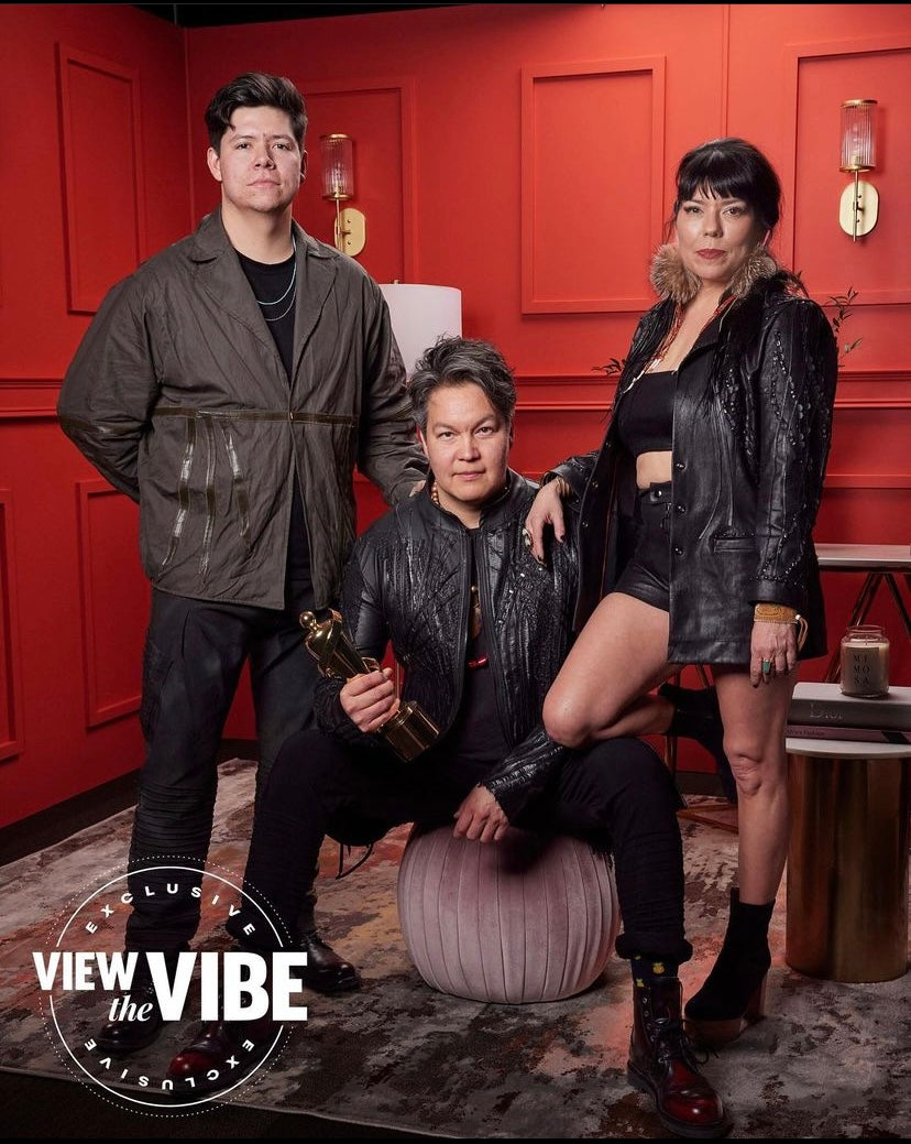The members of the band Digging Roots wearing call and response jackets, pants, and shorts at the Juno Awards.