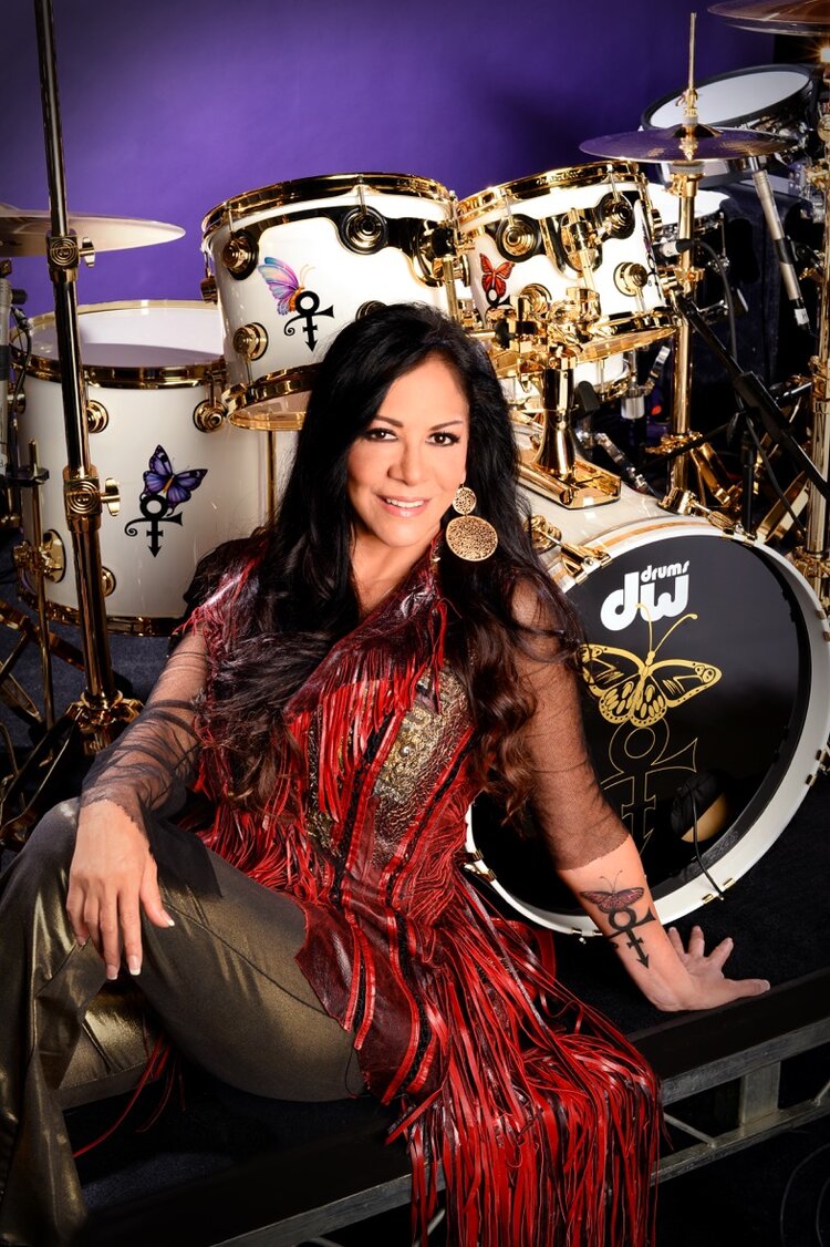 Sheila E wearing a call and response vest