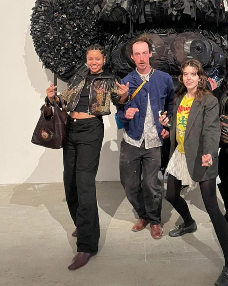 Tau Lewis wearing a call and response jacket