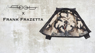 The inside view of the TOOL X Frank Frazetta X Call and response men's jacket. The jacket is open against a concrete background. The lining shows a fantasy warrior fighting off three flying monsters with a bloody sword.