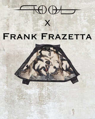 The inside view of the TOOL X Frank Frazetta X Call and response men's jacket. The jacket is open against a concrete background. The lining shows a fantasy warrior fighting off three flying monsters with a bloody sword.