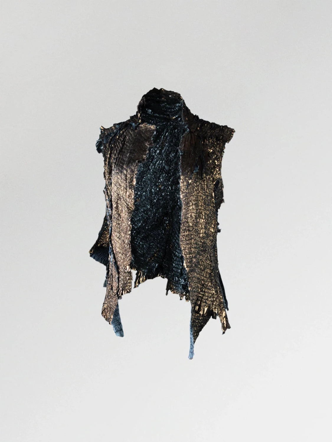 A metallic gold gathered viscose vest with irregular raw edges and an asymmetrical shape.
