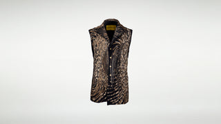 A black vest overlayed with layers of swirling leopard-print leather appliqué. Metal snaps down the front.