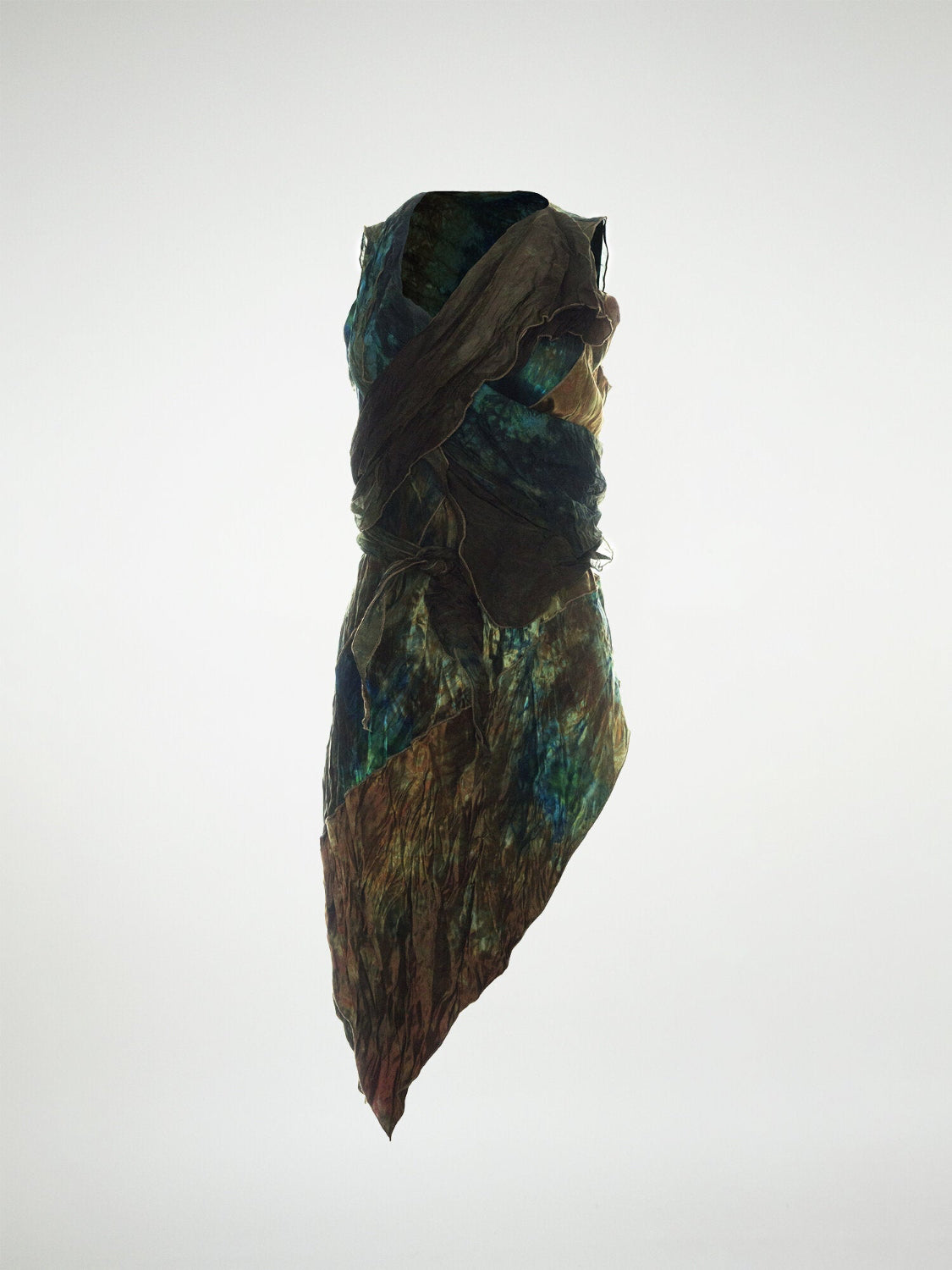 A asymmetrical hand-dyed silk top with wrap detail.