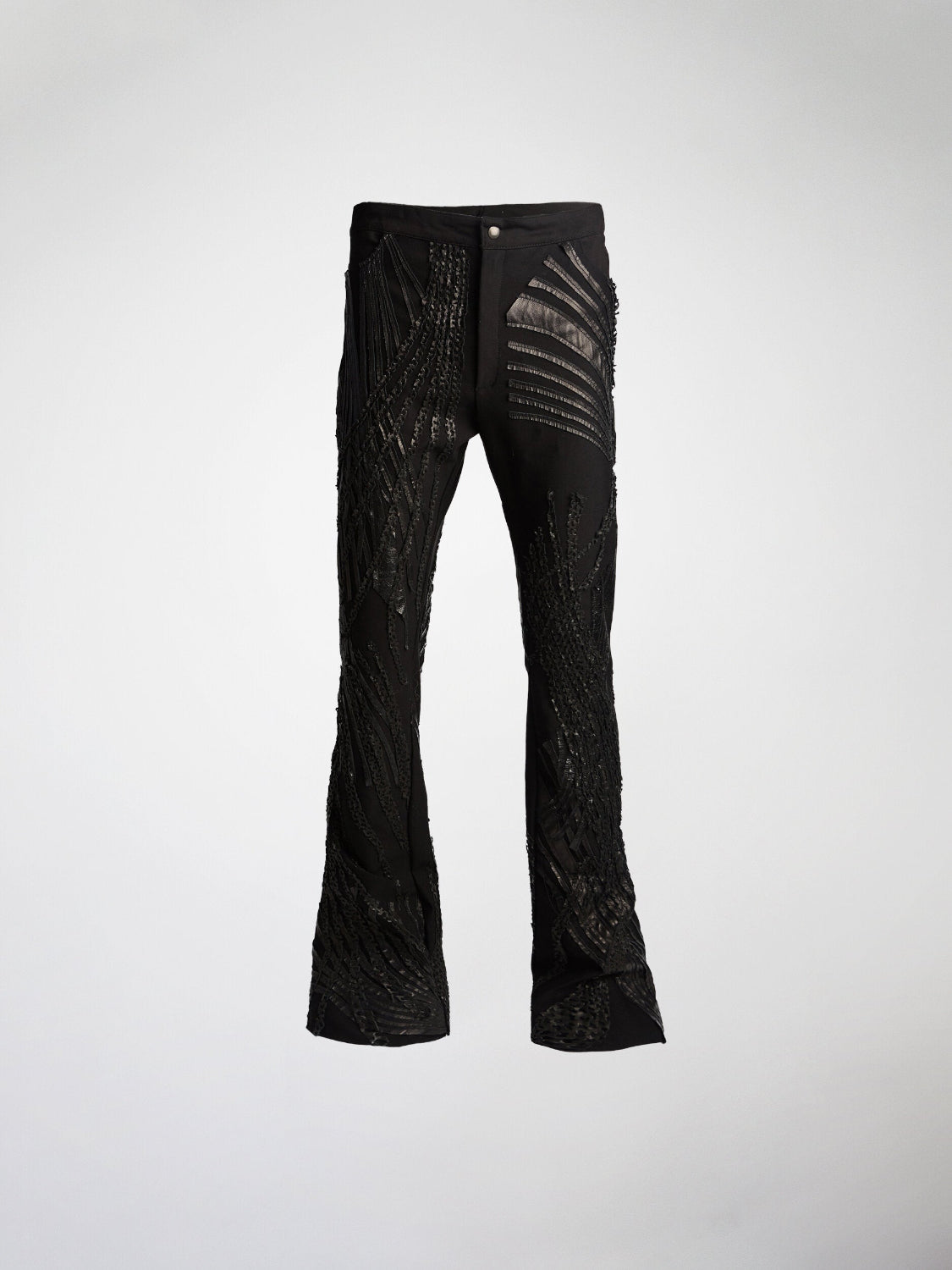 Pair of black pants with lamb leather overlay and metal snap and zipper fly closure.